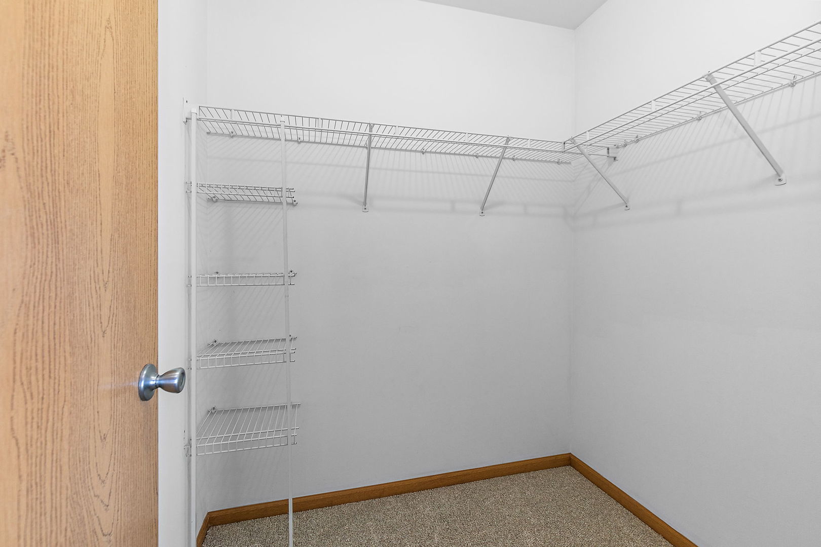 614 Littleton Trail Elgin, IL 60120 - Photo 24 of 29 a view of a room with racks on the wall