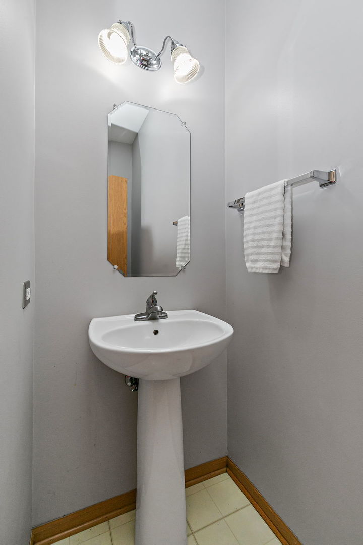 614 Littleton Trail Elgin, IL 60120 - Photo 8 of 29 a bathroom with a sink a mirror and vanity