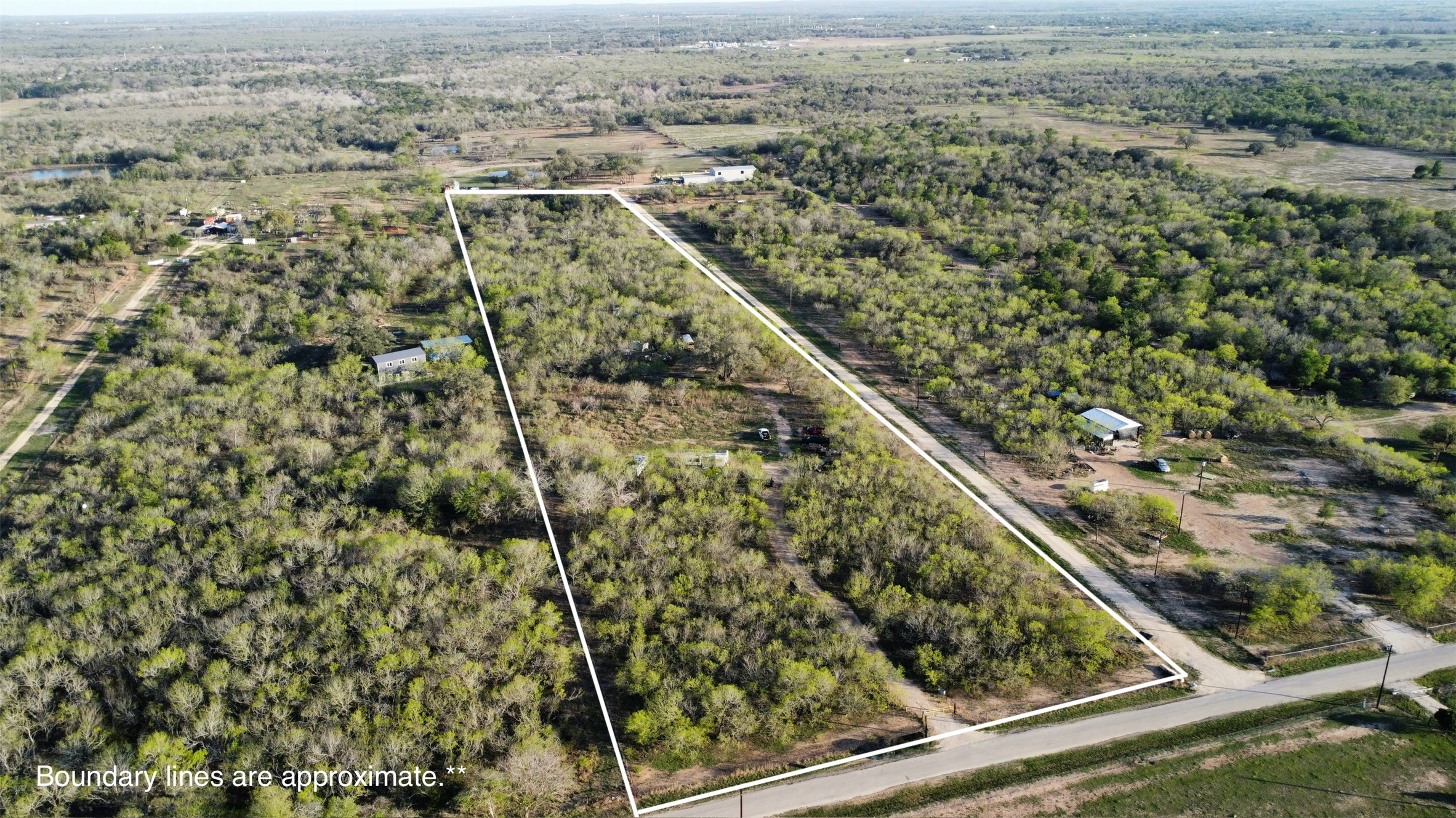 2209 Callihan Road Luling, TX 78648 - Photo 6 of 7 View of rural area featuring property boundaries highlighted and a forest