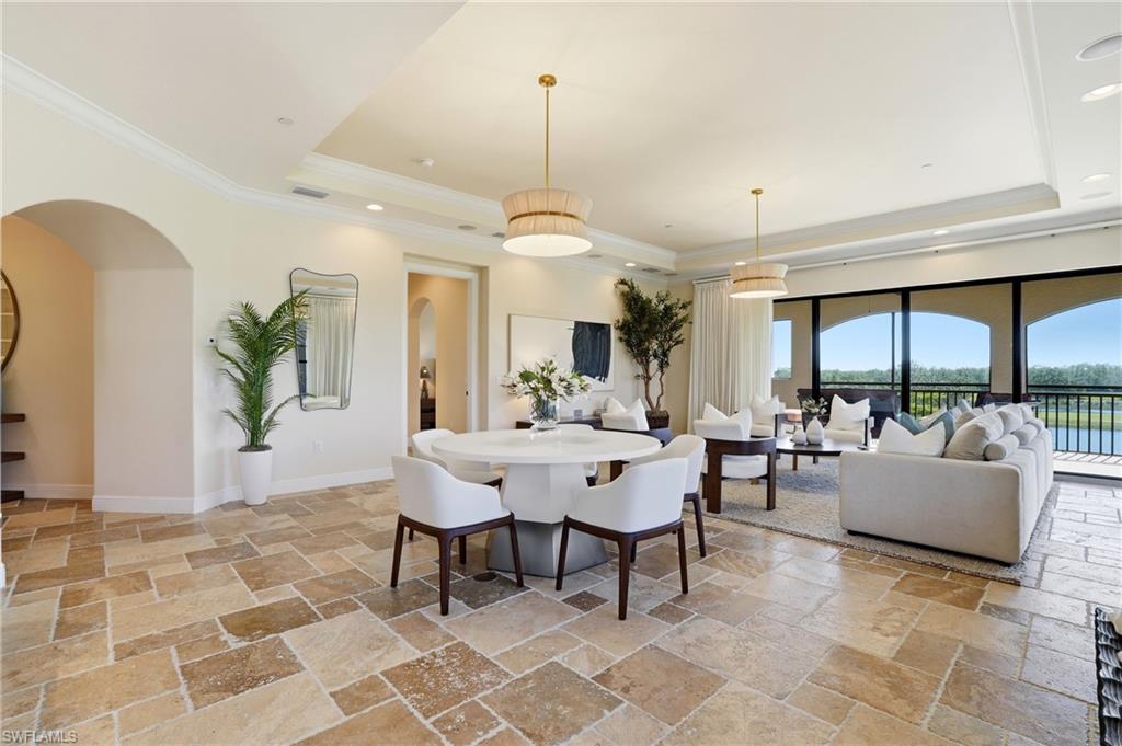 2546 Marquesa Royale Lane, Unit 7302 Naples, FL 34109 - Photo 13 of 46 a view of a livingroom with furniture and window