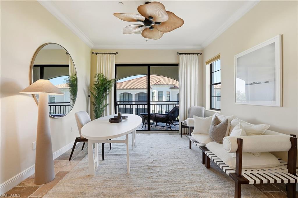 2546 Marquesa Royale Lane, Unit 7302 Naples, FL 34109 - Photo 32 of 46 a living room with furniture a table and chairs