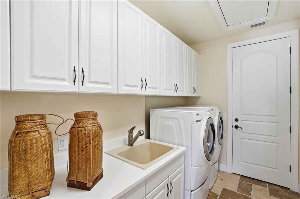 2546 Marquesa Royale Lane, Unit 7302 Naples, FL 34109 - Photo 35 of 46 a utility room with dryer and washer