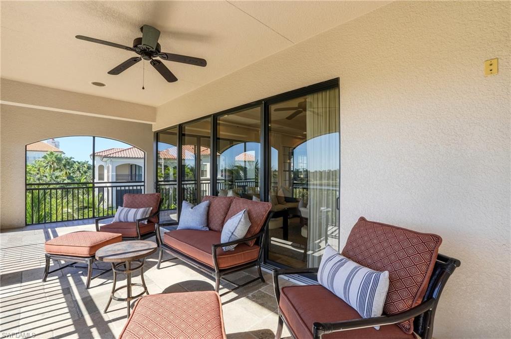 2546 Marquesa Royale Lane, Unit 7302 Naples, FL 34109 - Photo 38 of 46 a living room with furniture and a window