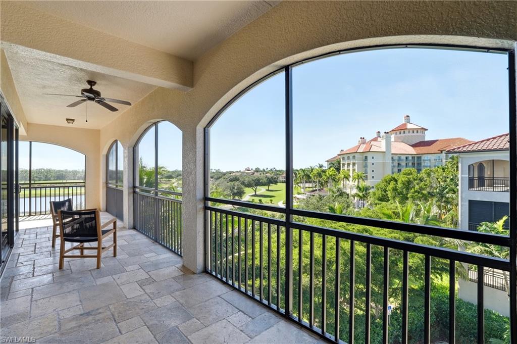 2546 Marquesa Royale Lane, Unit 7302 Naples, FL 34109 - Photo 42 of 46 a view of a porch with furniture and a yard