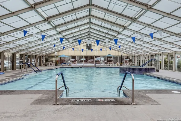 a view of a swimming pool with a patio