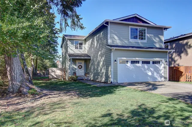 a front view of a house with a yard