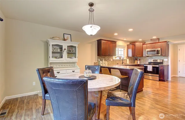 a view of a dining room with furniture