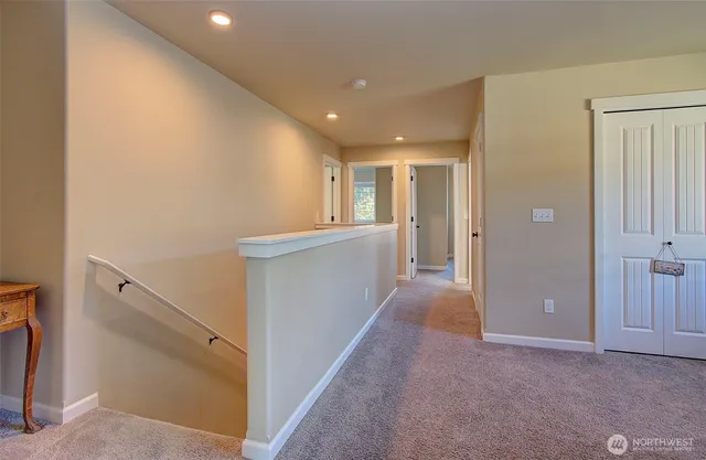 a bedroom with a bed and a book shelf