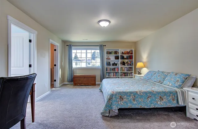 a bedroom with a bed and furniture