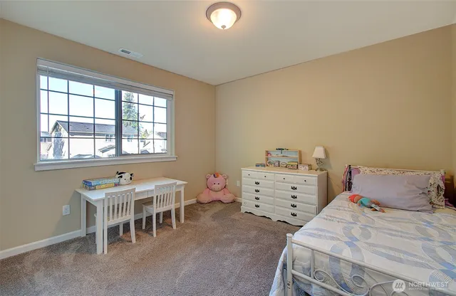 a bedroom with a bed and closet