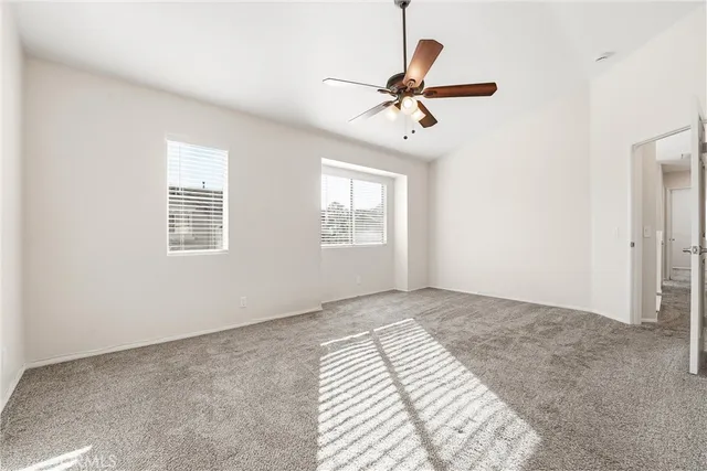 a spacious bathroom with a double vanity sink a mirror and a shower