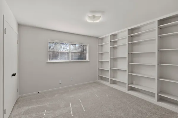 a bathroom with a sink and cabinets