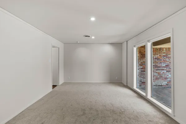 a large kitchen with kitchen island a sink stainless steel appliances and cabinets