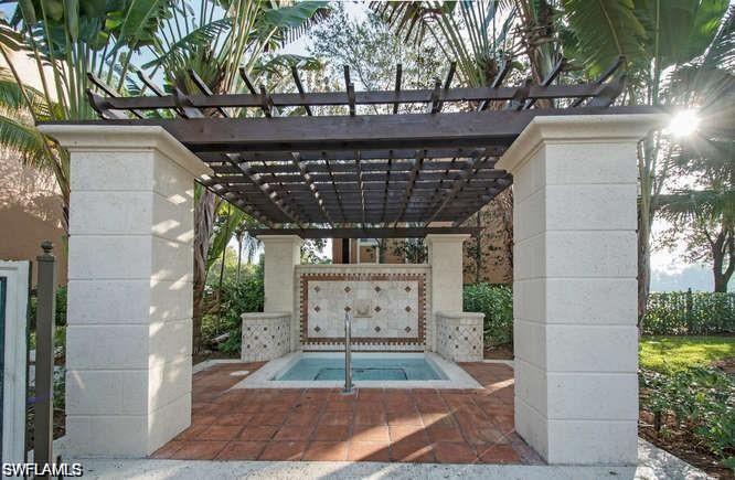 1115 Reserve Court, Unit 2201 Naples, FL 34105 - Photo 13 of 18 a view of entryway with a yard