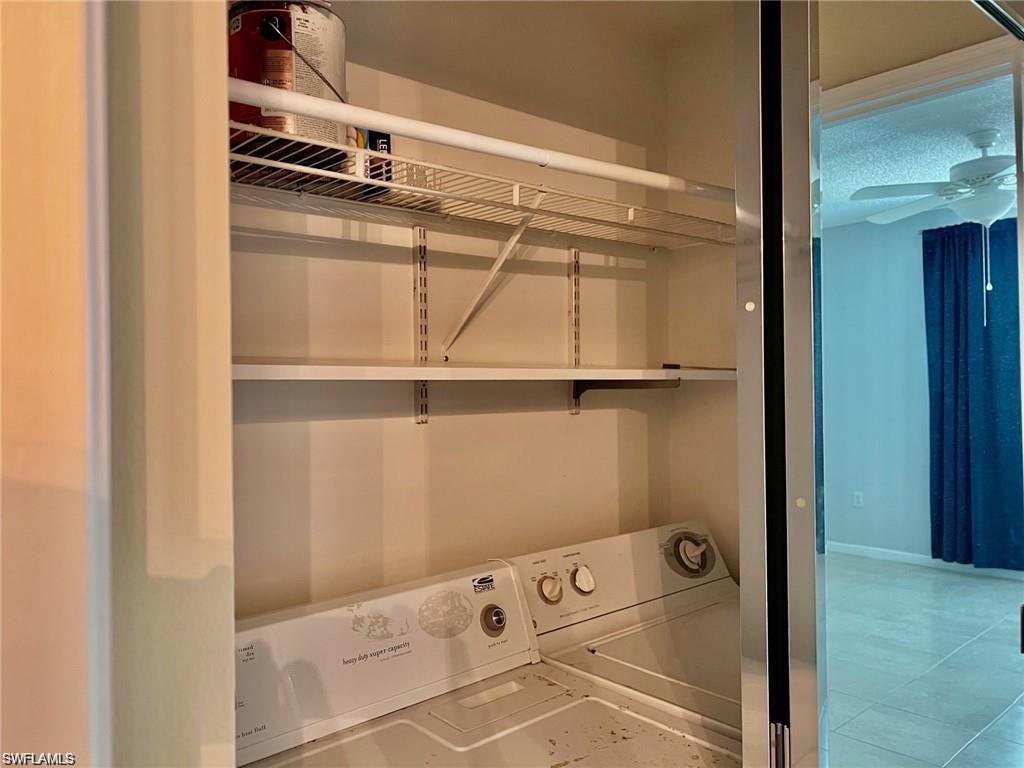 1115 Reserve Court, Unit 2201 Naples, FL 34105 - Photo 3 of 18 storage and utility room with cabinet