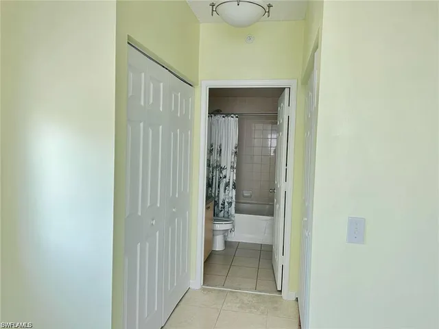 a view of a bathroom from a hallway