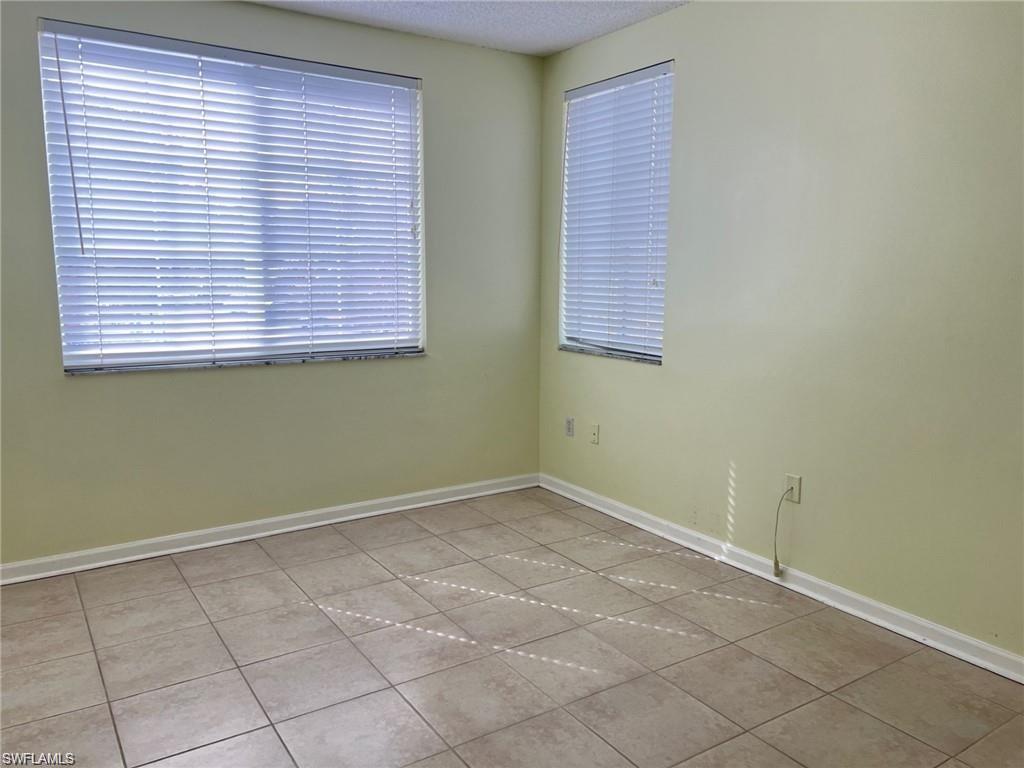 1115 Reserve Court, Unit 2201 Naples, FL 34105 - Photo 6 of 18 an empty room with a window