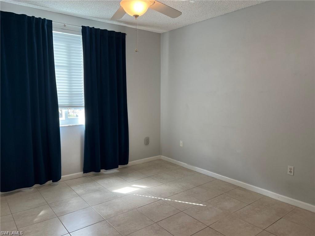 1115 Reserve Court, Unit 2201 Naples, FL 34105 - Photo 8 of 18 an empty room with windows