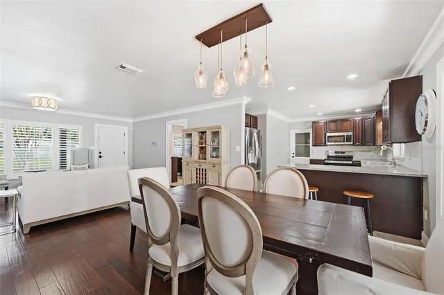 a dining room with furniture and window