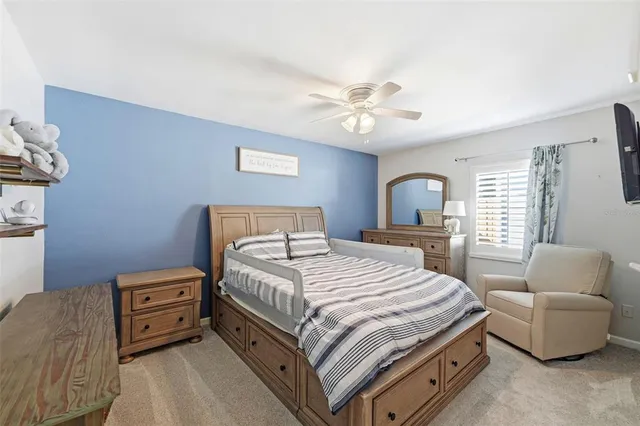 a bedroom with a bed and a couch