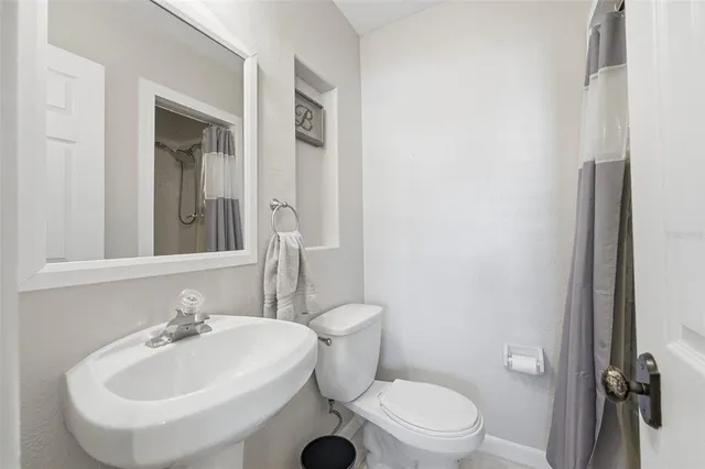 a bathroom with a sink and a toilet