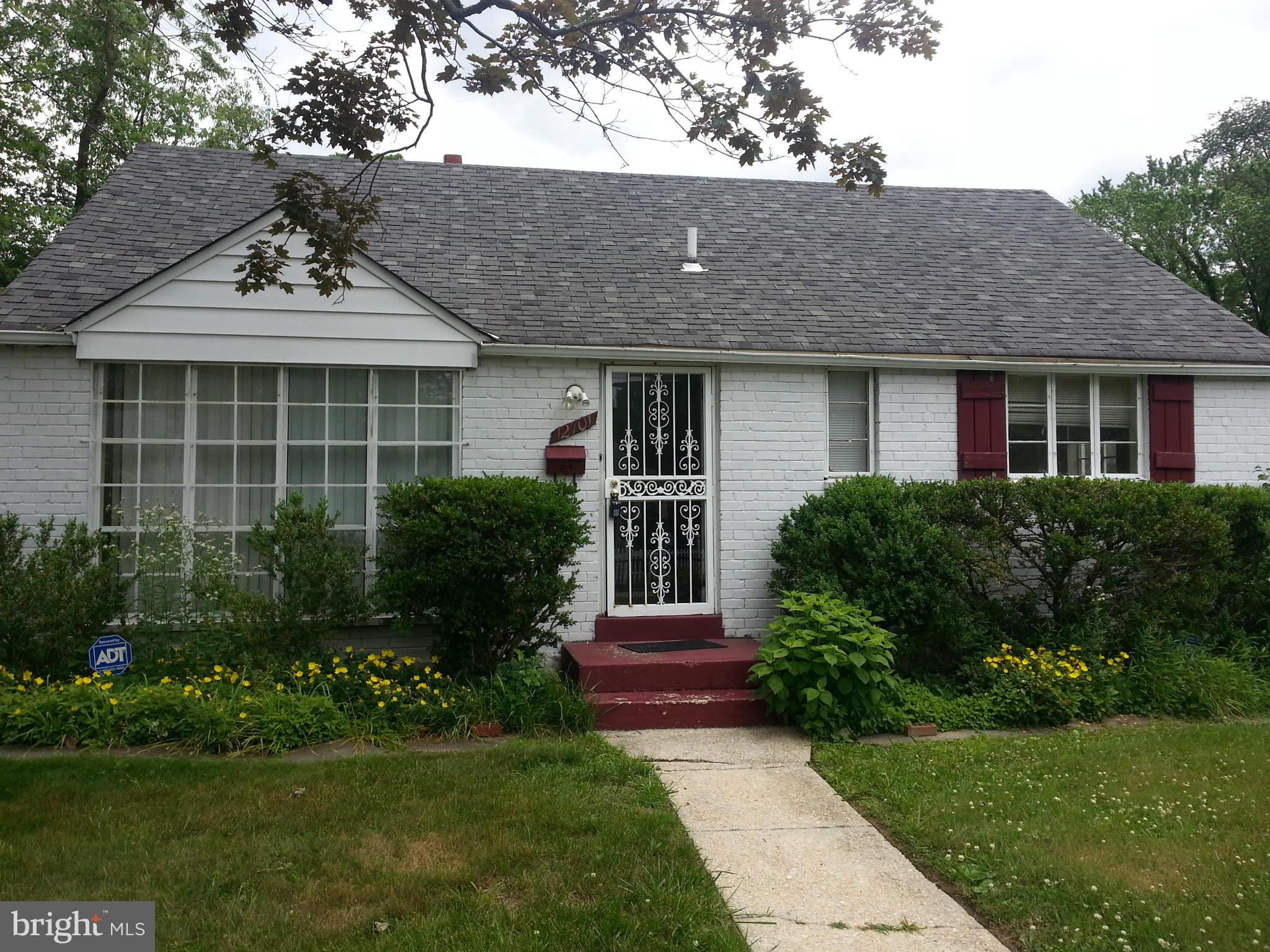 12701 Gould Road Silver Spring, MD 20906 - Photo 1 of 30 a front view of a house with garden