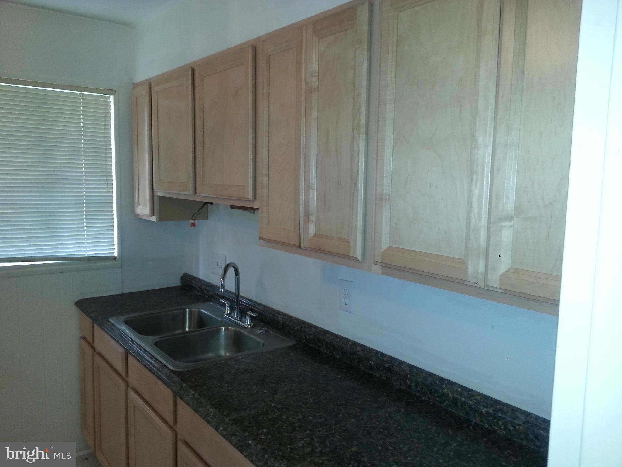 12701 Gould Road Silver Spring, MD 20906 - Photo 14 of 30 a kitchen with a sink and cabinets