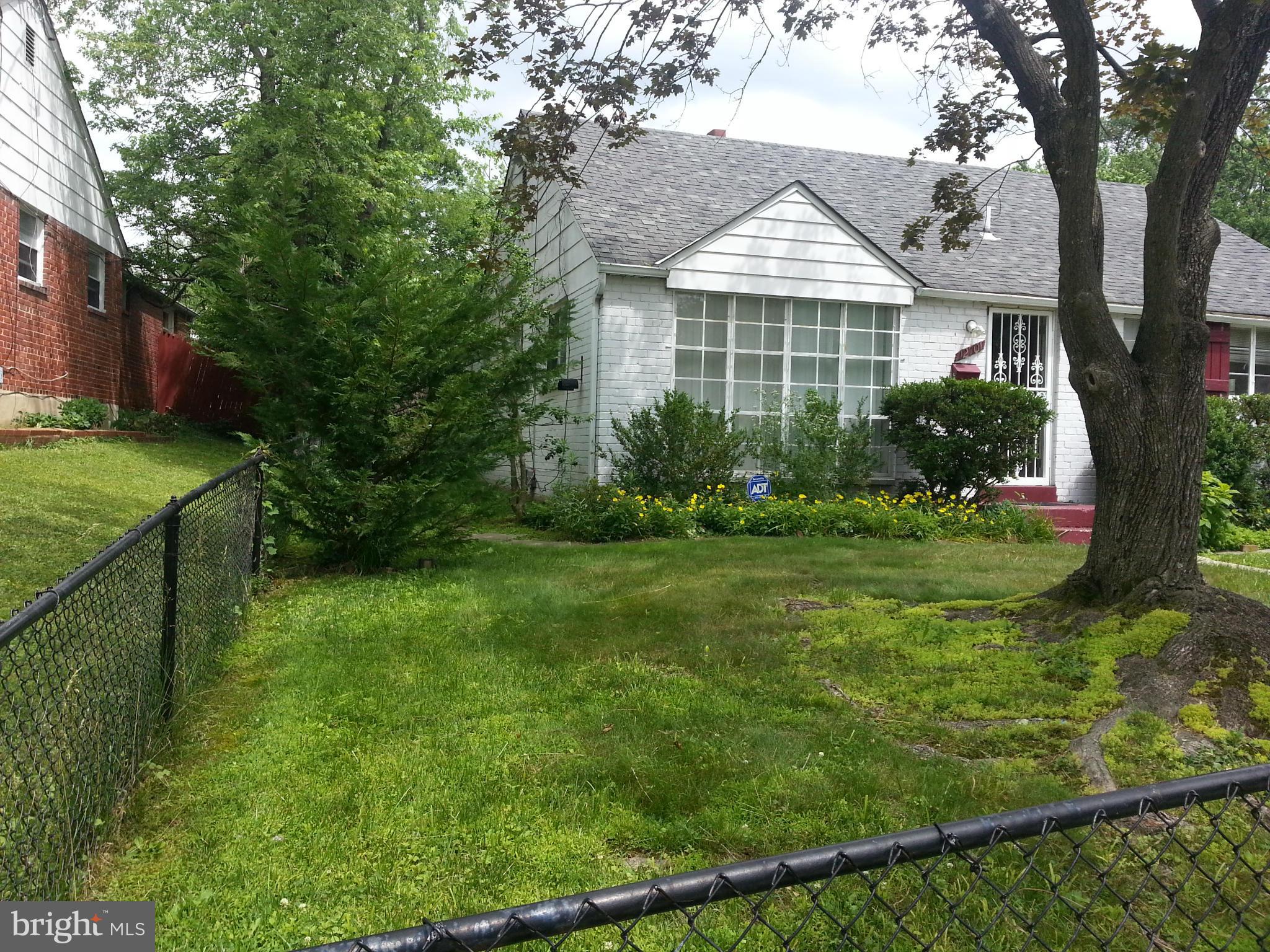 12701 Gould Road Silver Spring, MD 20906 - Photo 22 of 30 a front view of a house with a yard