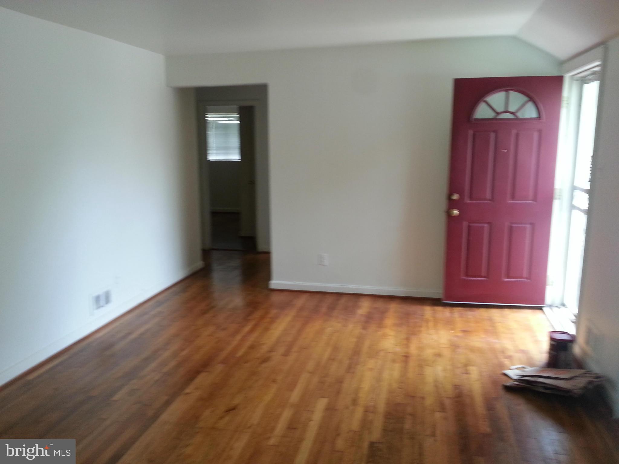12701 Gould Road Silver Spring, MD 20906 - Photo 7 of 30 a view of a room with wooden floor and a window