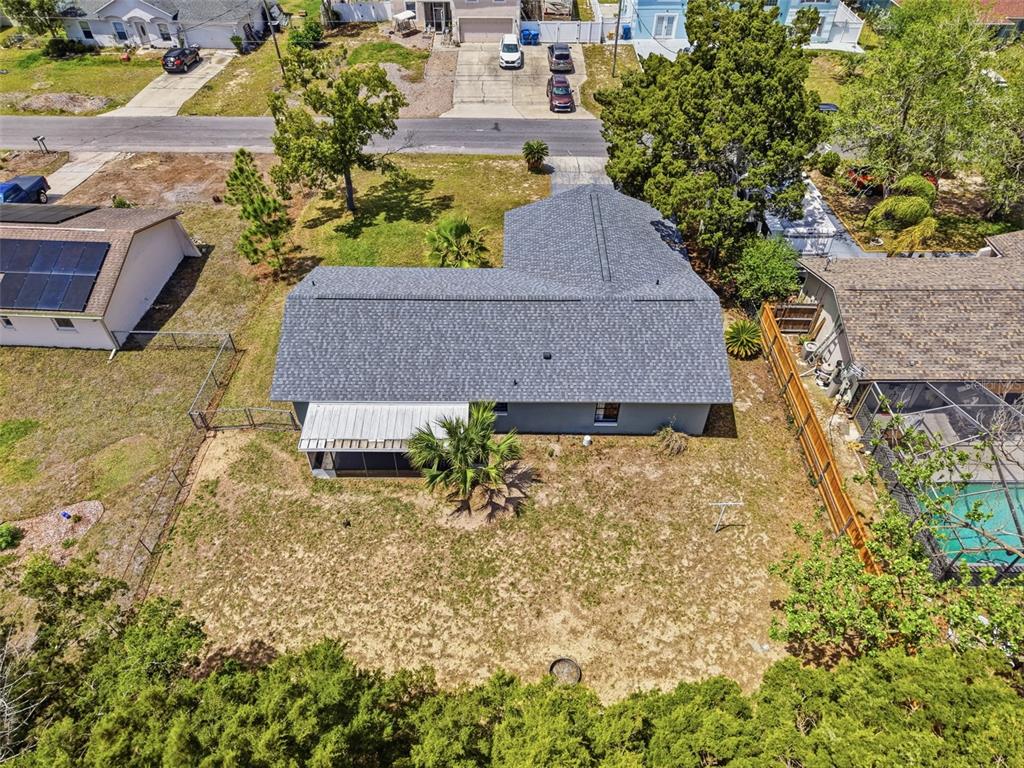 5384 Baldock Avenue Spring Hill, FL 34608 - Photo 8 of 51 an aerial view of a house with large trees
