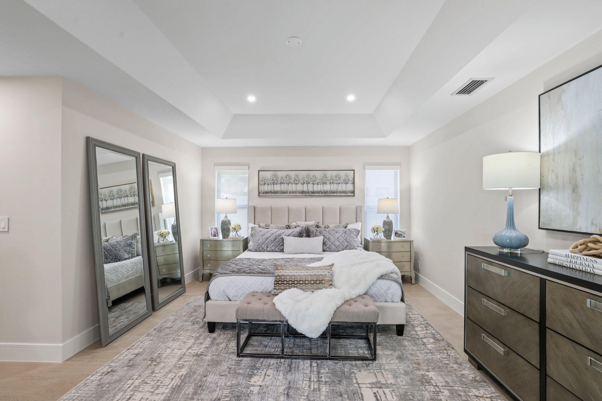 3901 Northwest 27th Avenue Boca Raton, FL 33434 - Photo 30 of 56 a bedroom with a bed and wooden floor