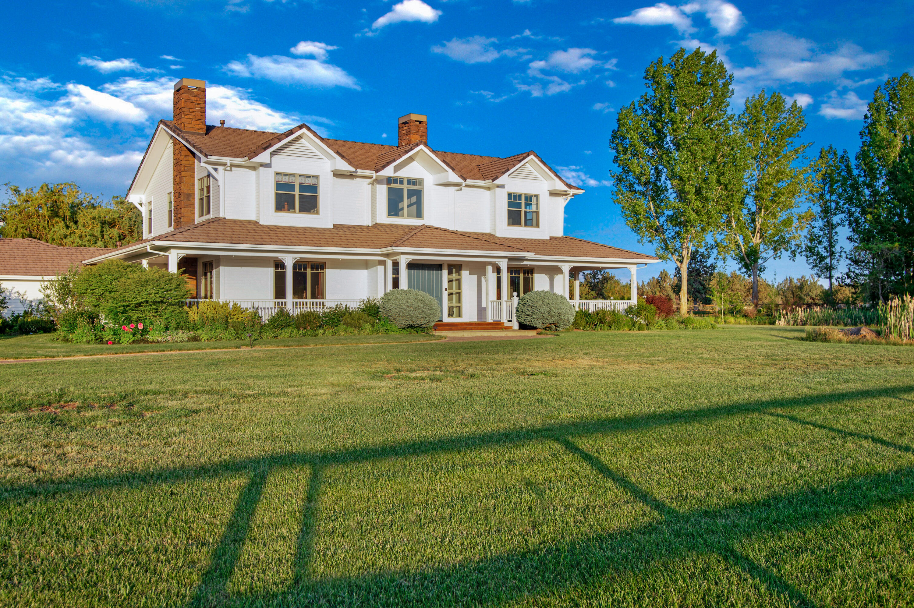 64950 Collins Road Bend, OR 97703 - Photo 6 of 87 a front view of a house with a garden