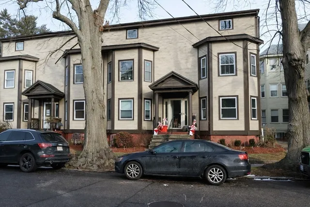 a car parked in front of a house