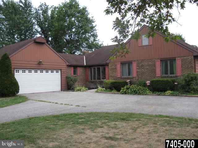 263 White Hall Road Littlestown, PA 17340 - Photo 1 of 16 a front view of a house with a yard and garage