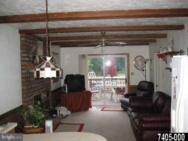 263 White Hall Road Littlestown, PA 17340 - Photo 11 of 16 a living room with furniture a window and a fireplace