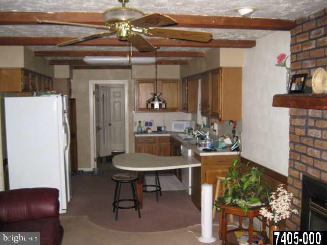 263 White Hall Road Littlestown, PA 17340 - Photo 12 of 16 a dining room with furniture and a kitchen view