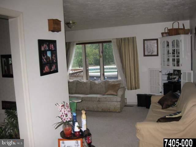 263 White Hall Road Littlestown, PA 17340 - Photo 16 of 16 a living room with furniture and a window