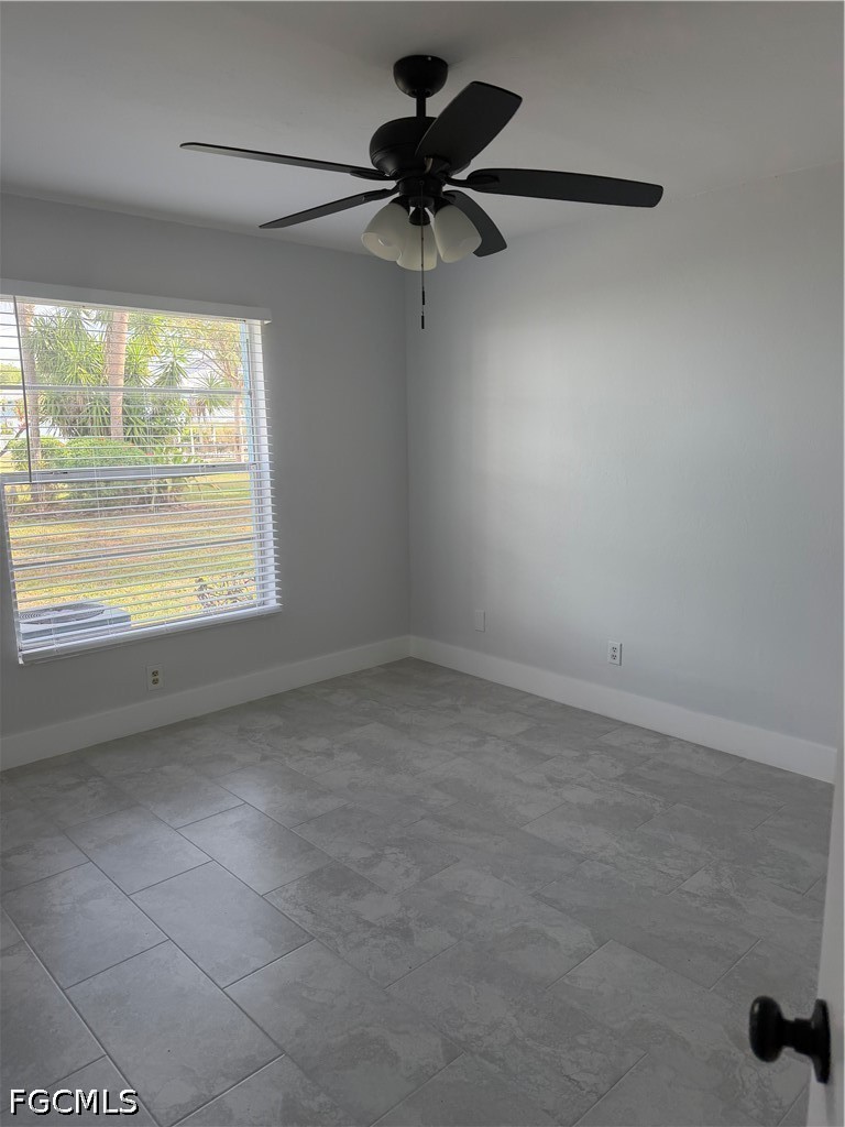 1100 Pondella Road, Unit 703 Cape Coral, FL 33909 - Photo 11 of 16 a view of a room with a window and a ceiling fan