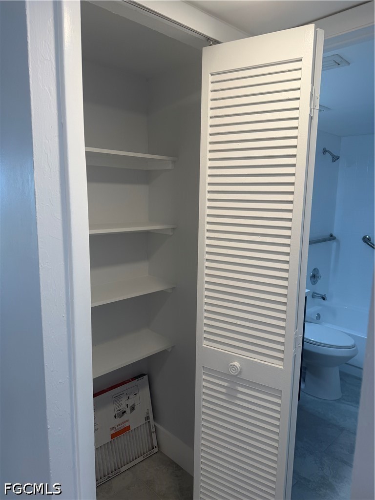 1100 Pondella Road, Unit 703 Cape Coral, FL 33909 - Photo 13 of 16 a bathroom view with a toilet