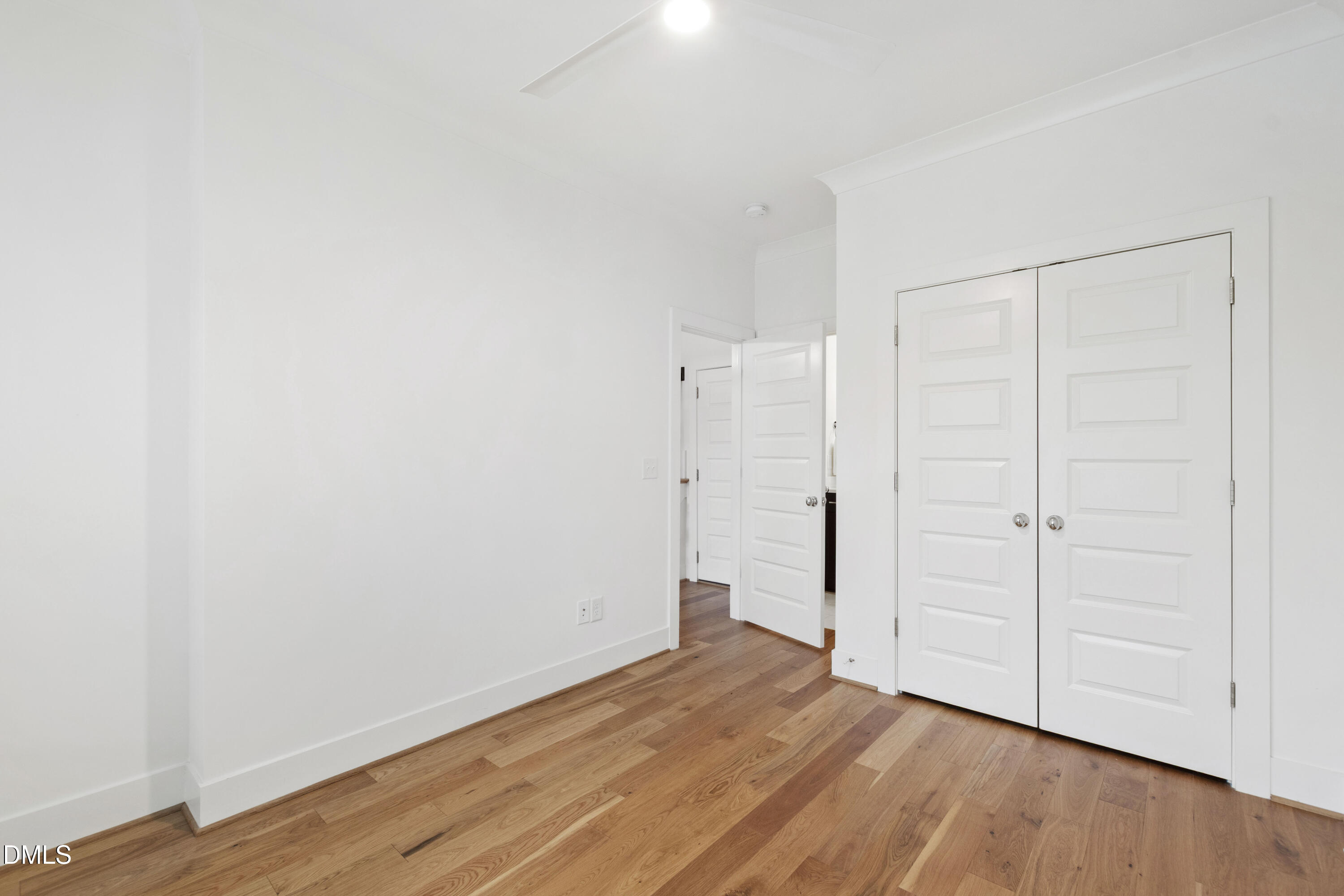 718 Peakland Place Raleigh, NC 27604 - Photo 11 of 48 a view of an empty room with wooden floor