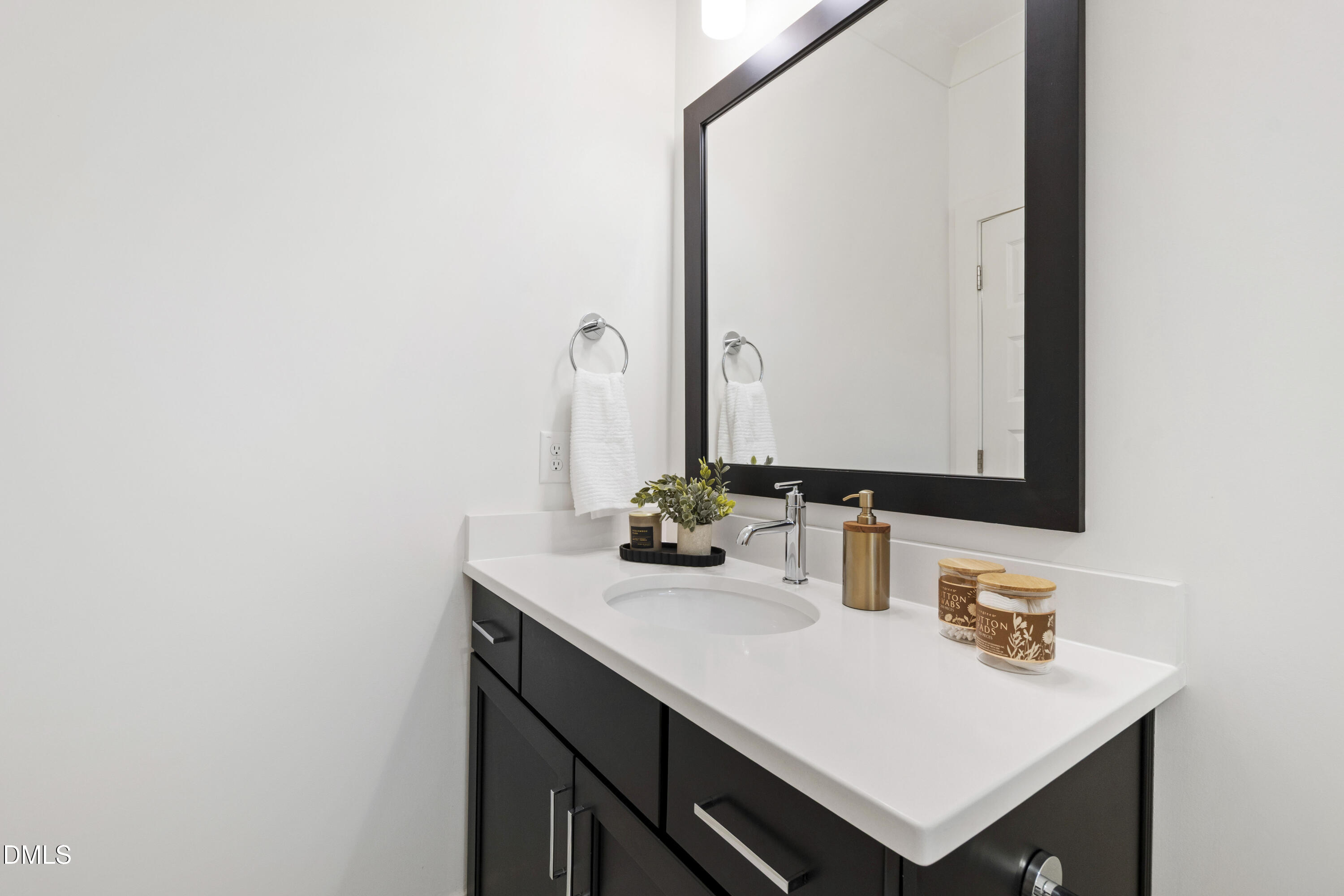 718 Peakland Place Raleigh, NC 27604 - Photo 12 of 48 a bathroom with a sink and a mirror