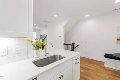a kitchen with a sink and a refrigerator