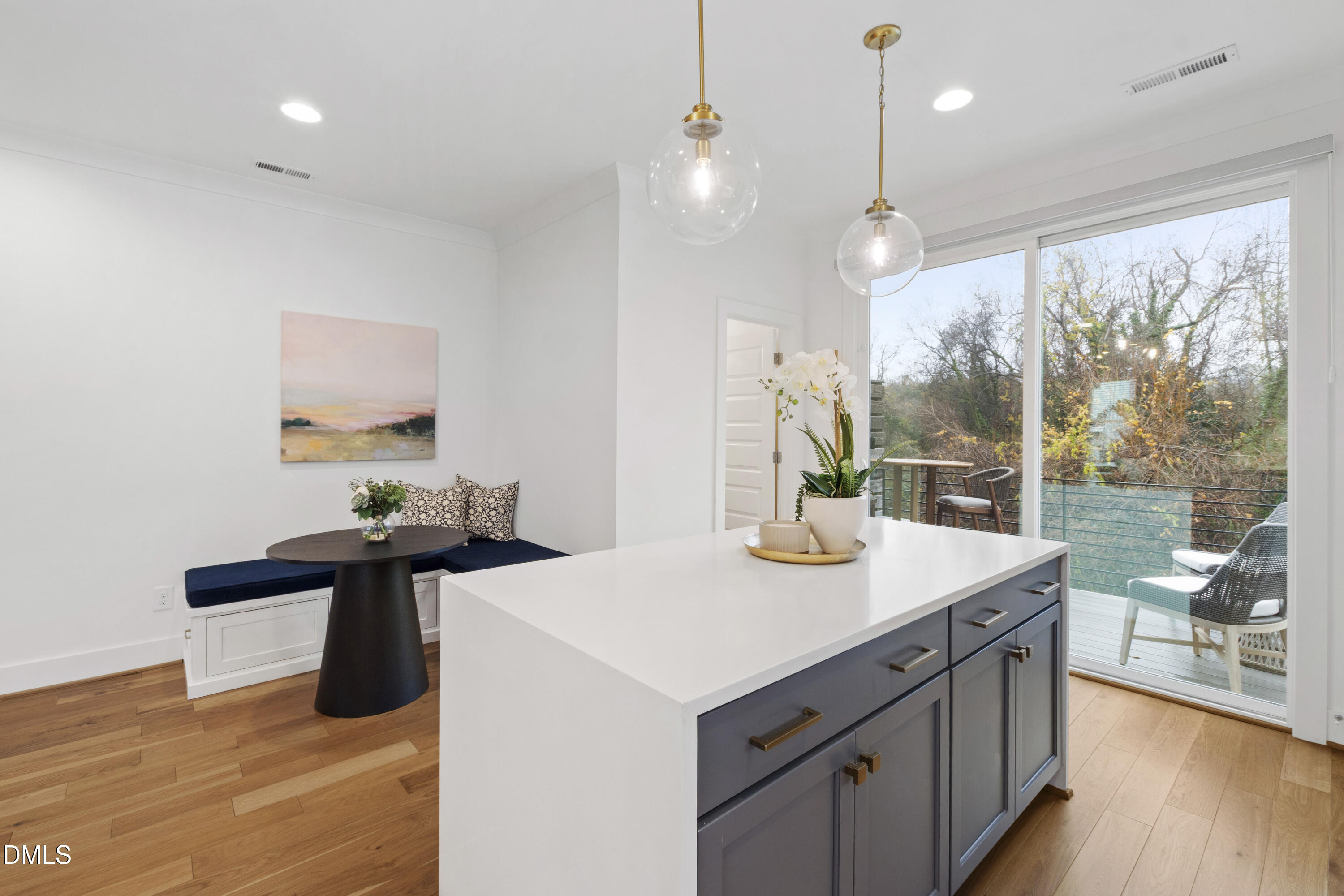 718 Peakland Place Raleigh, NC 27604 - Photo 26 of 48 a kitchen with a sink and wooden floor