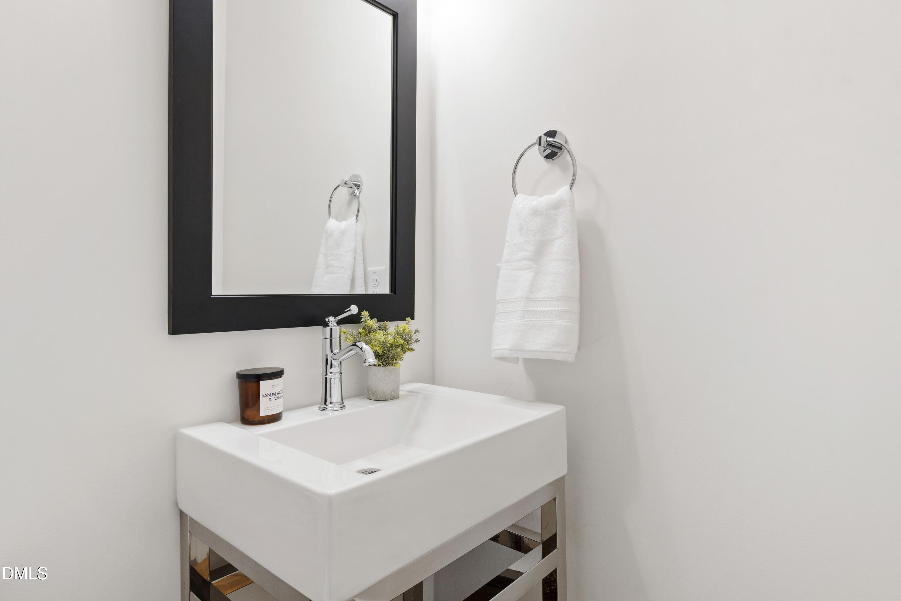 718 Peakland Place Raleigh, NC 27604 - Photo 39 of 48 a bathroom with a sink and a mirror