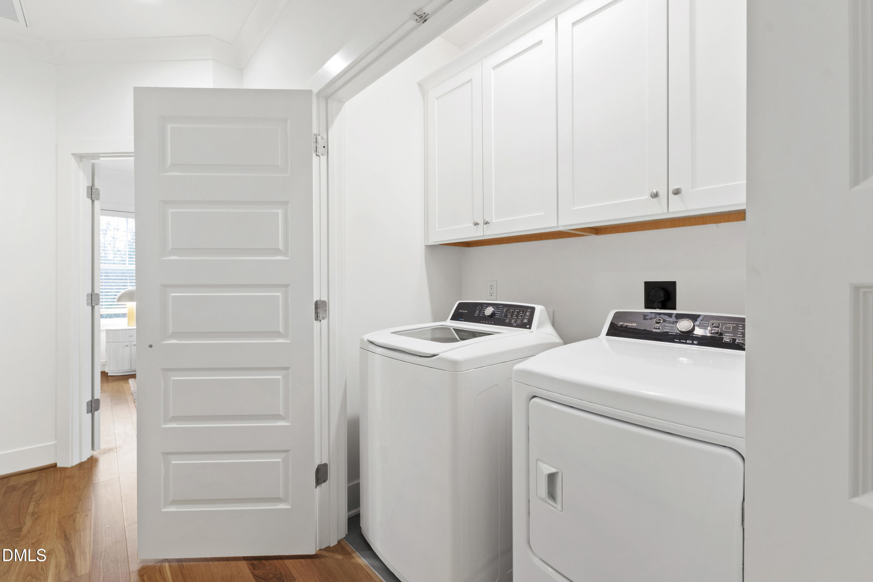 718 Peakland Place Raleigh, NC 27604 - Photo 40 of 48 a view of storage and utility room with washer and dryer