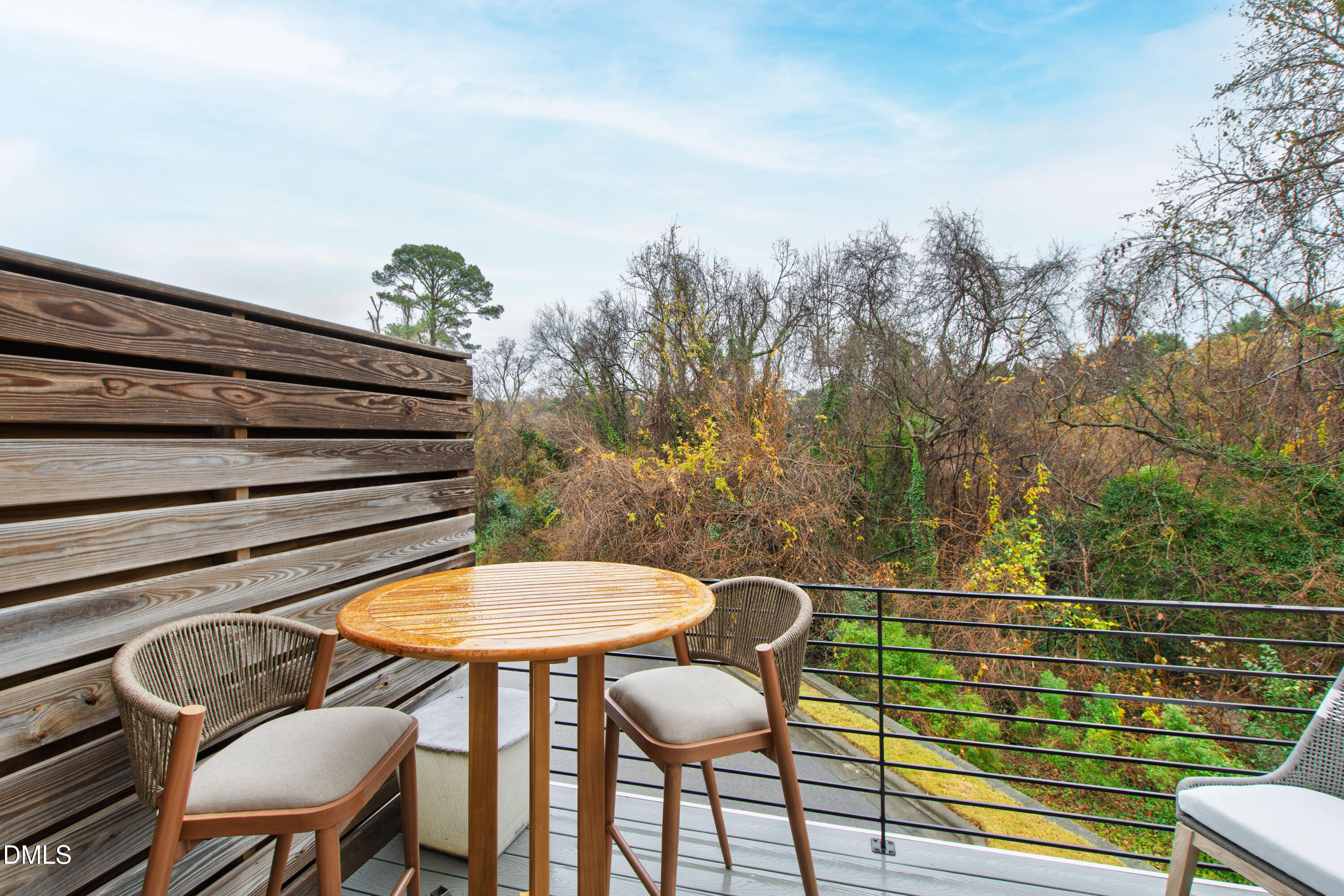 718 Peakland Place Raleigh, NC 27604 - Photo 41 of 48 a view of a chairs and table in the back yard of the house