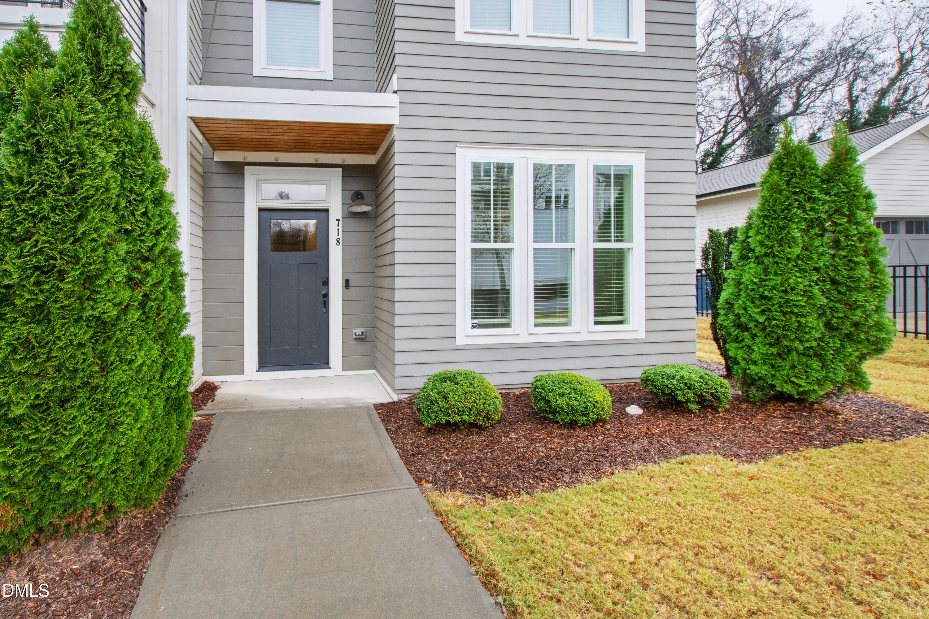 718 Peakland Place Raleigh, NC 27604 - Photo 7 of 48 a front view of a house with garden