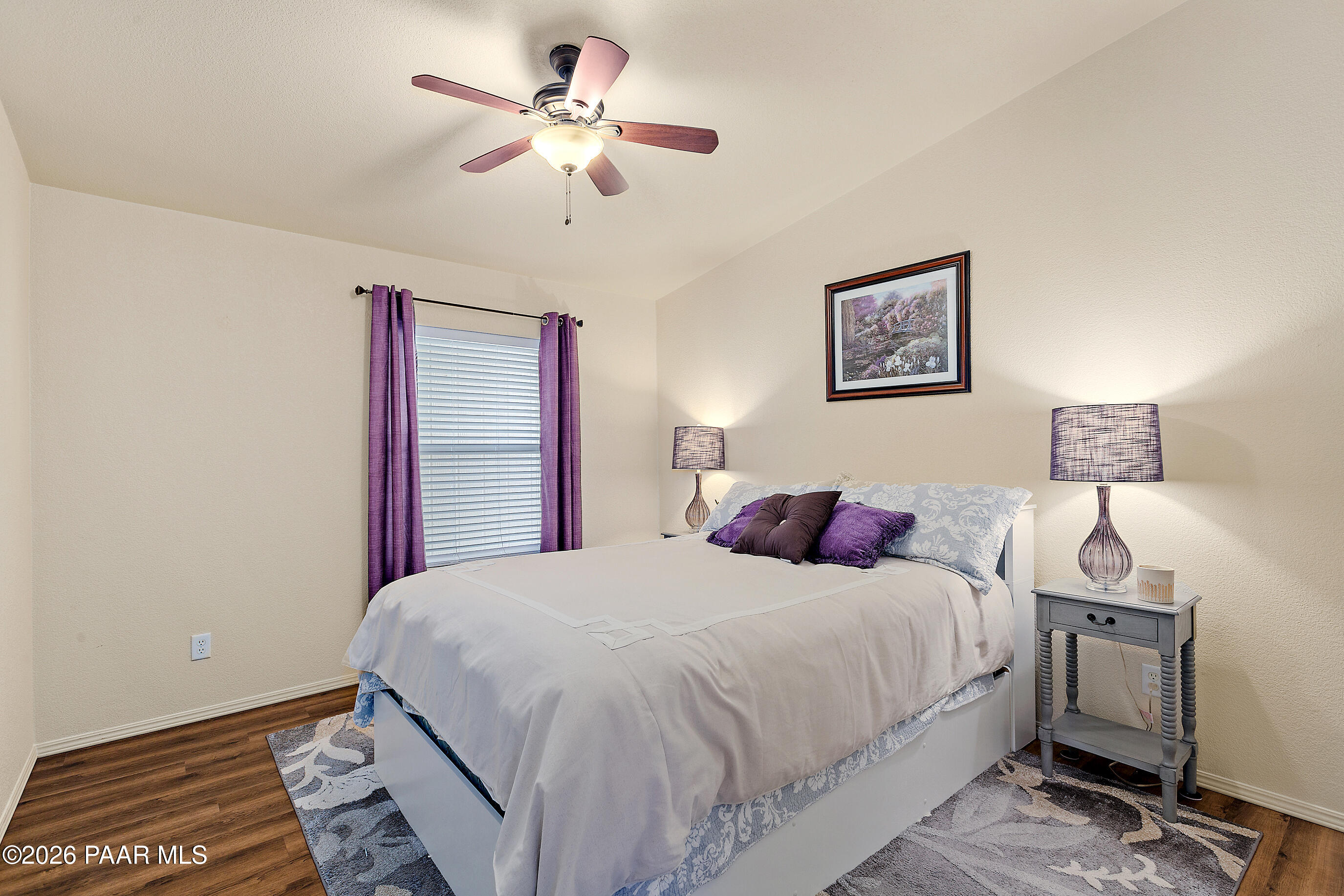 11250 East State Rte 69 Dewey, AZ 86327 - Photo 21 of 38 a bedroom with a bed and a chandelier