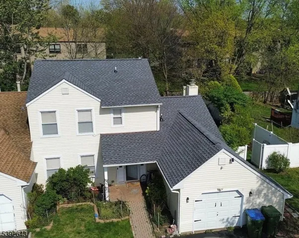 a aerial view of a house with a yard