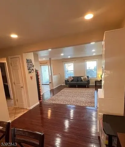 a kitchen with stainless steel appliances granite countertop a stove a refrigerator and a microwave